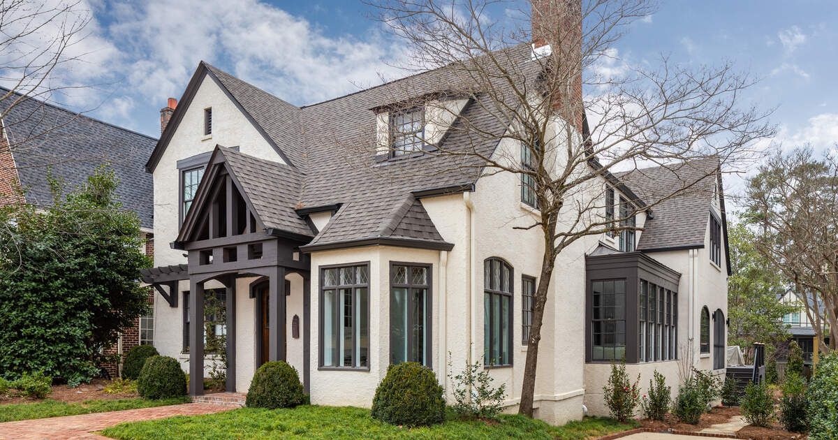 White brick Tudor-style Atlanta home awaiting a professional inspection